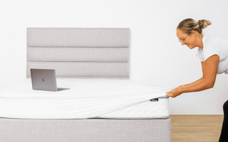 Fitting a waterproof mattress protector over a mattress