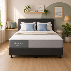 Naptime Ease mattress on a charcoal bed base in a styled bedroom