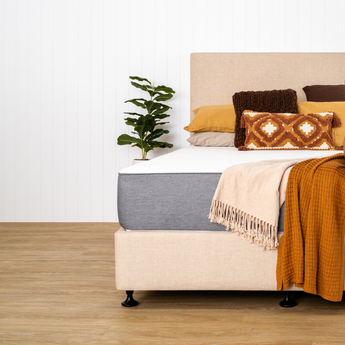 Naptime dual mattress and bed base with pillows and throws