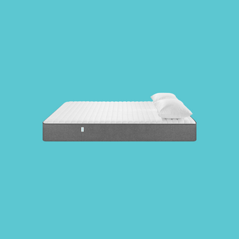 Naptime mattress with pillows on a teal background