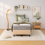 Bedroom with a bed labeled 'Osteo Support' and decorative pillows and bed base