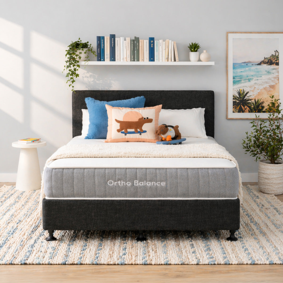 Bedroom with Ortho Balance mattress, bed base, pillows, and a headboard.