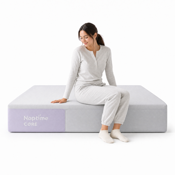Person sitting on the edge of the Naptime Core mattress