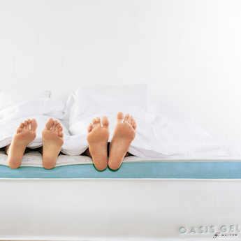 Oasis Gel mattress with two peoples feet hanging off the mattress