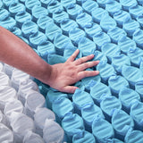 Hand on pocket springs pushing down