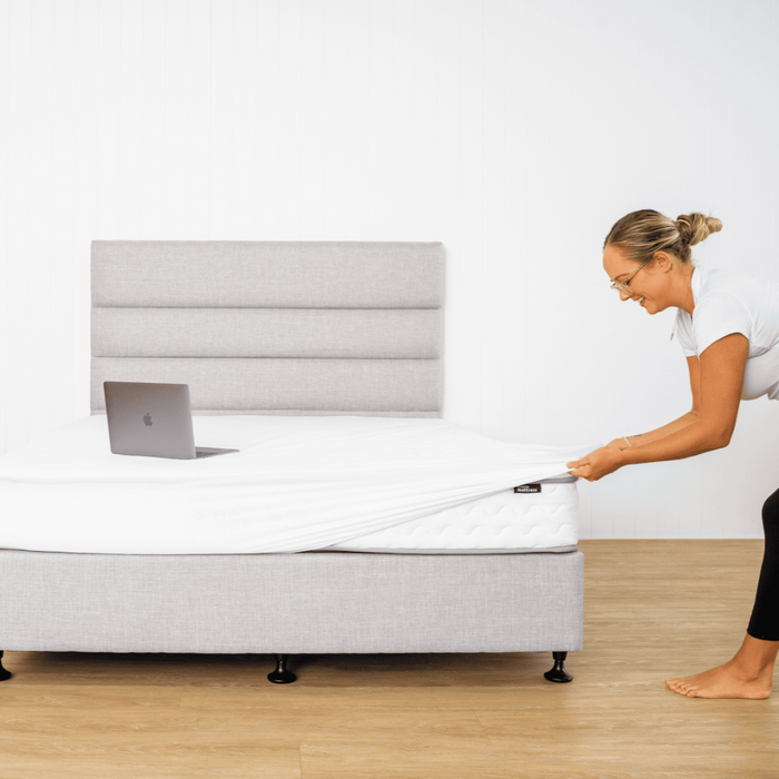 Fitting a waterproof mattress protector over a mattress