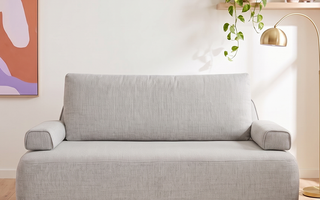 The Naptime Stay sofa bed in sofa mode in a bright living room