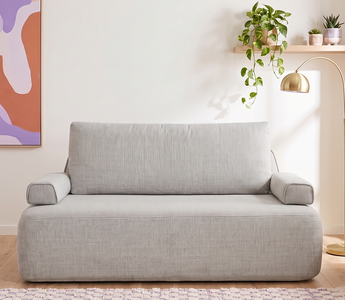 The Naptime Stay sofa bed in sofa mode in a bright living room