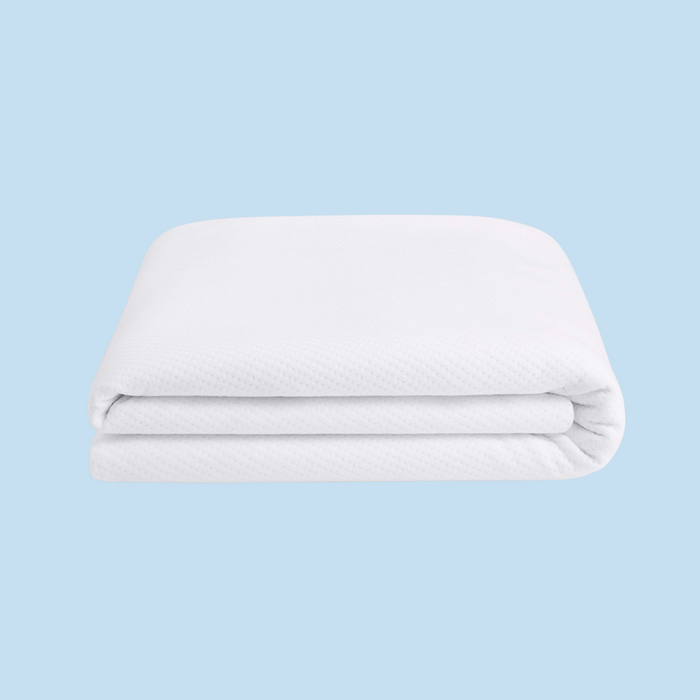 White mattress protector on a blue background