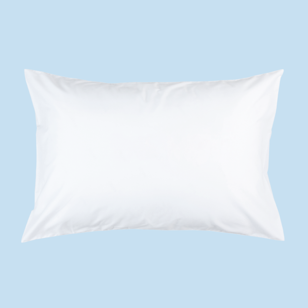 A white rectangular pillow against a blue background.