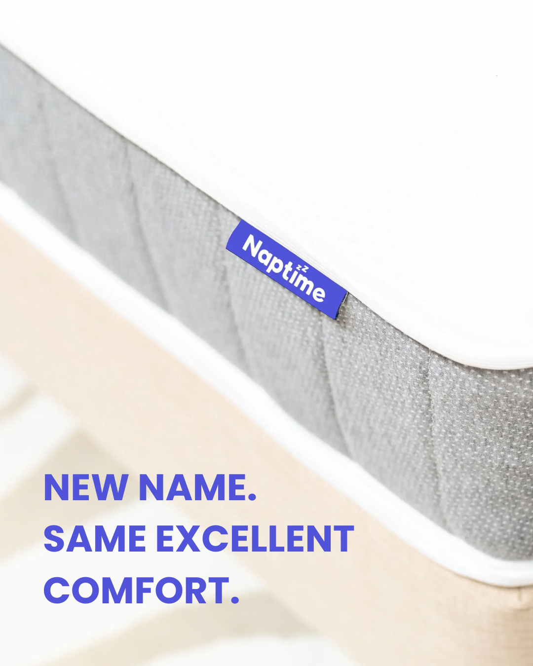 Gray mattress with 'Naptime' brand label on a white background