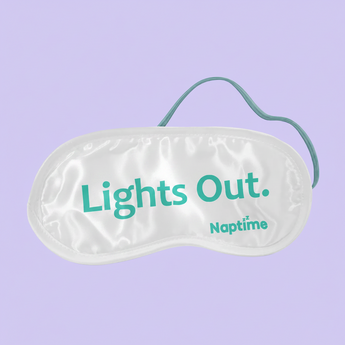 Sleep mask with 'Lights Out' text on a light gray background