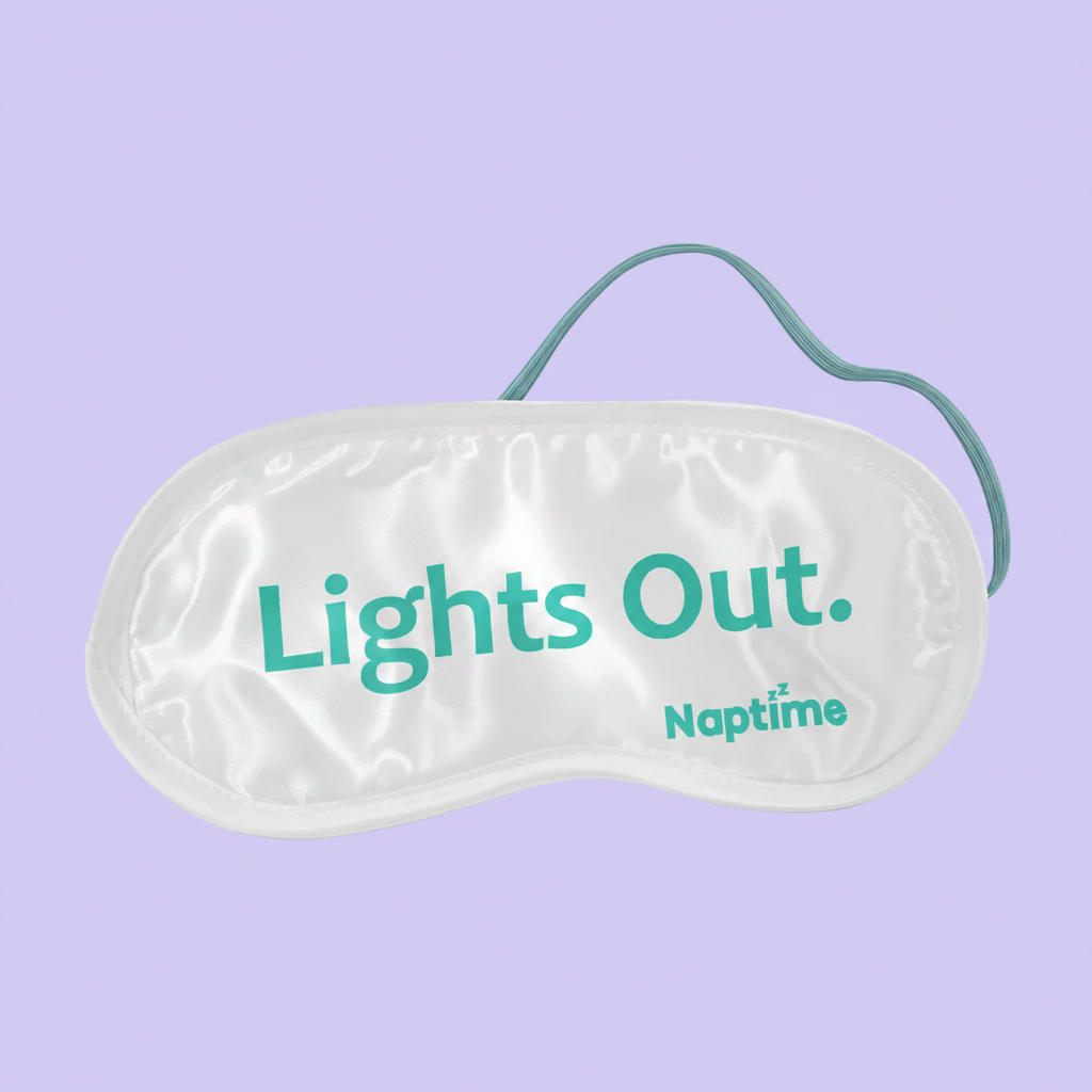 Sleep mask with 'Lights Out' text on a light gray background