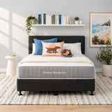 Bedroom with Ortho Balance mattress, bed base, pillows, and a headboard.