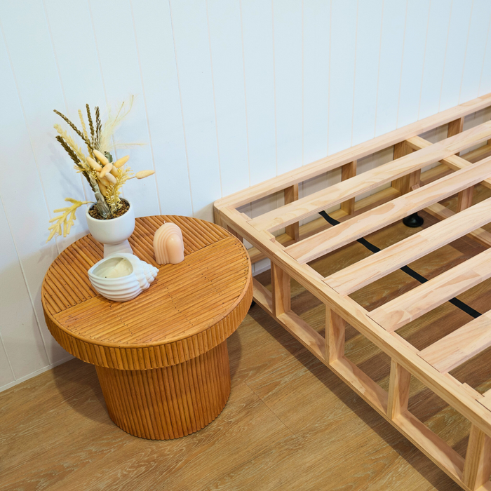 Bed base close up with side table 