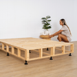 Scandi bed base with girl and pot plant 
