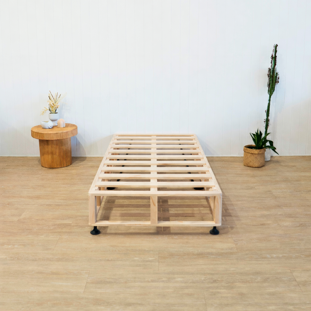Naptime Scandi bed frame on a wooden floor with a white wall background