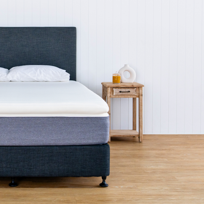 topper on a mattress pillows and bed base 